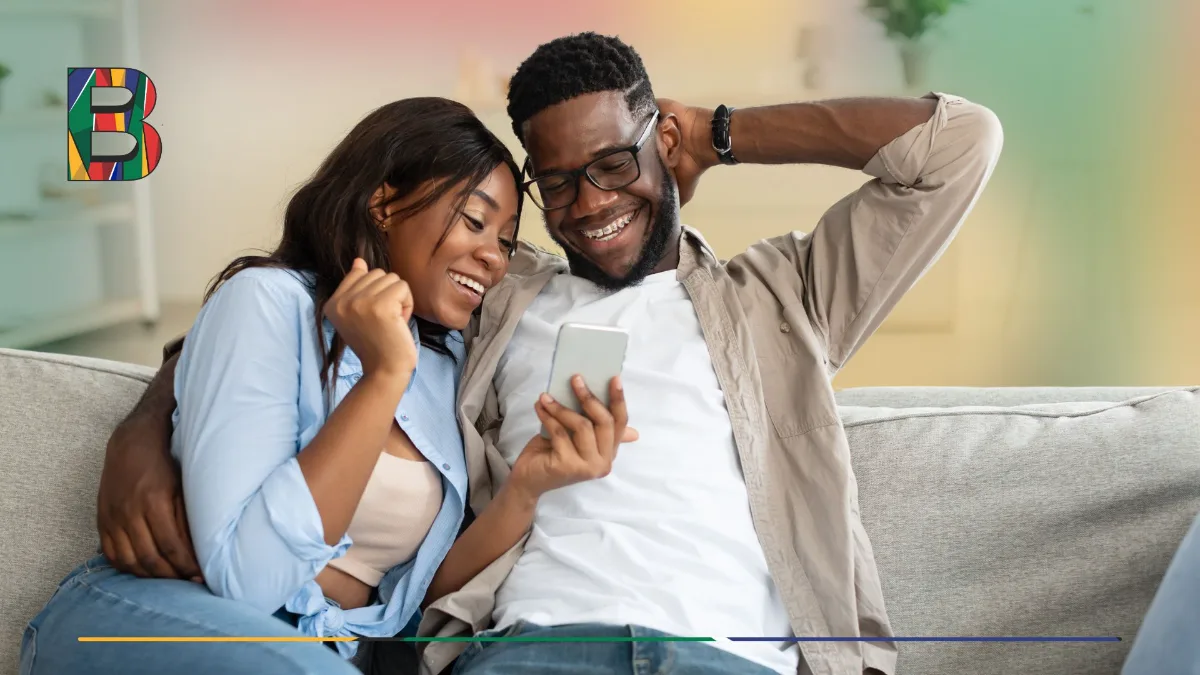 Couple exploring Barko loan options on a mobile phone.